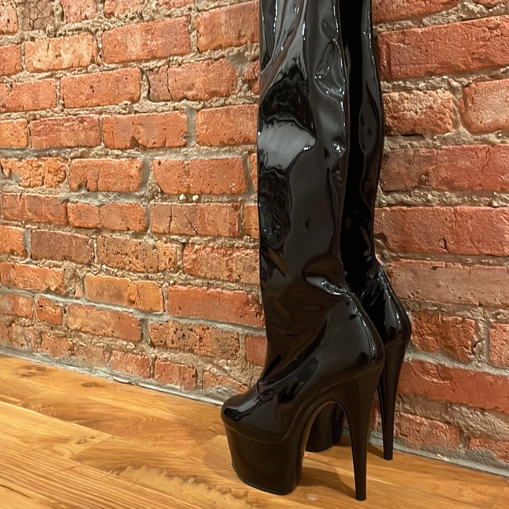 Black leather thigh high boots